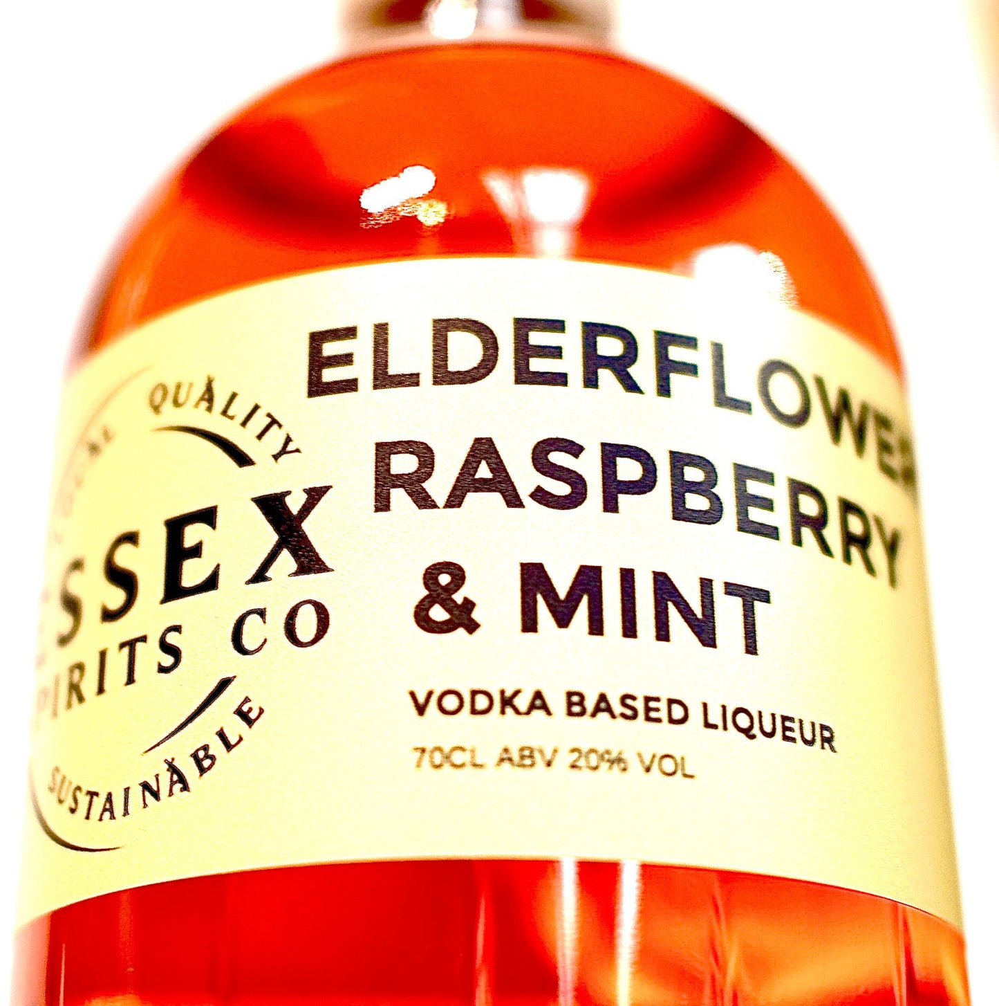 Bottle of Essex Spirits Co Elderflower Raspberry & Mint Vodka Based Liqueur with label.