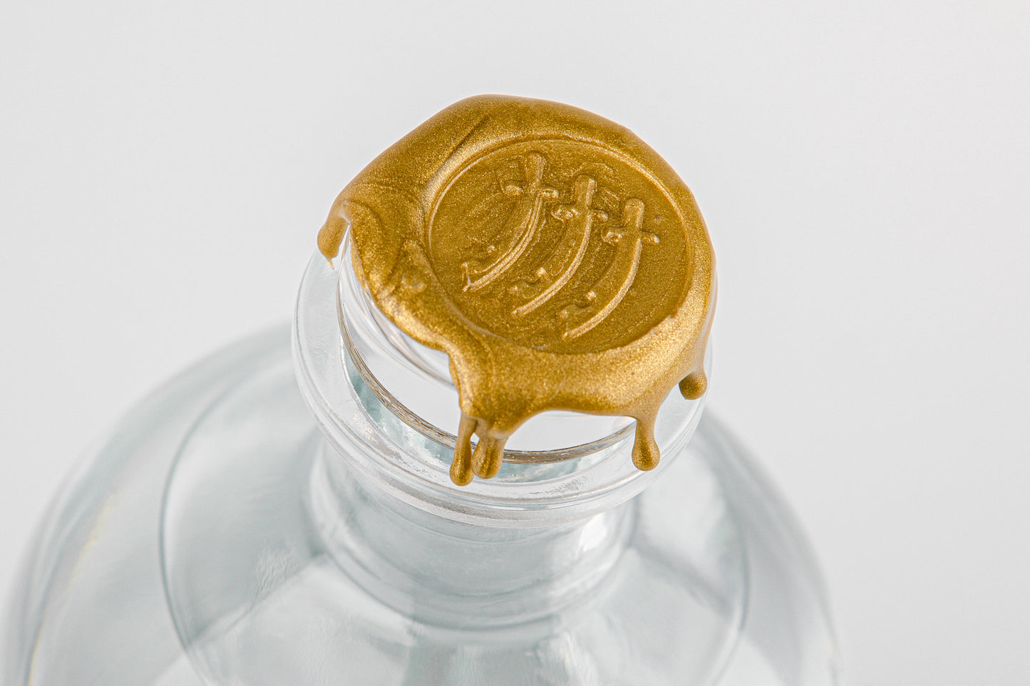 The wax seal of Essex swords on every Essex Spirits Company product